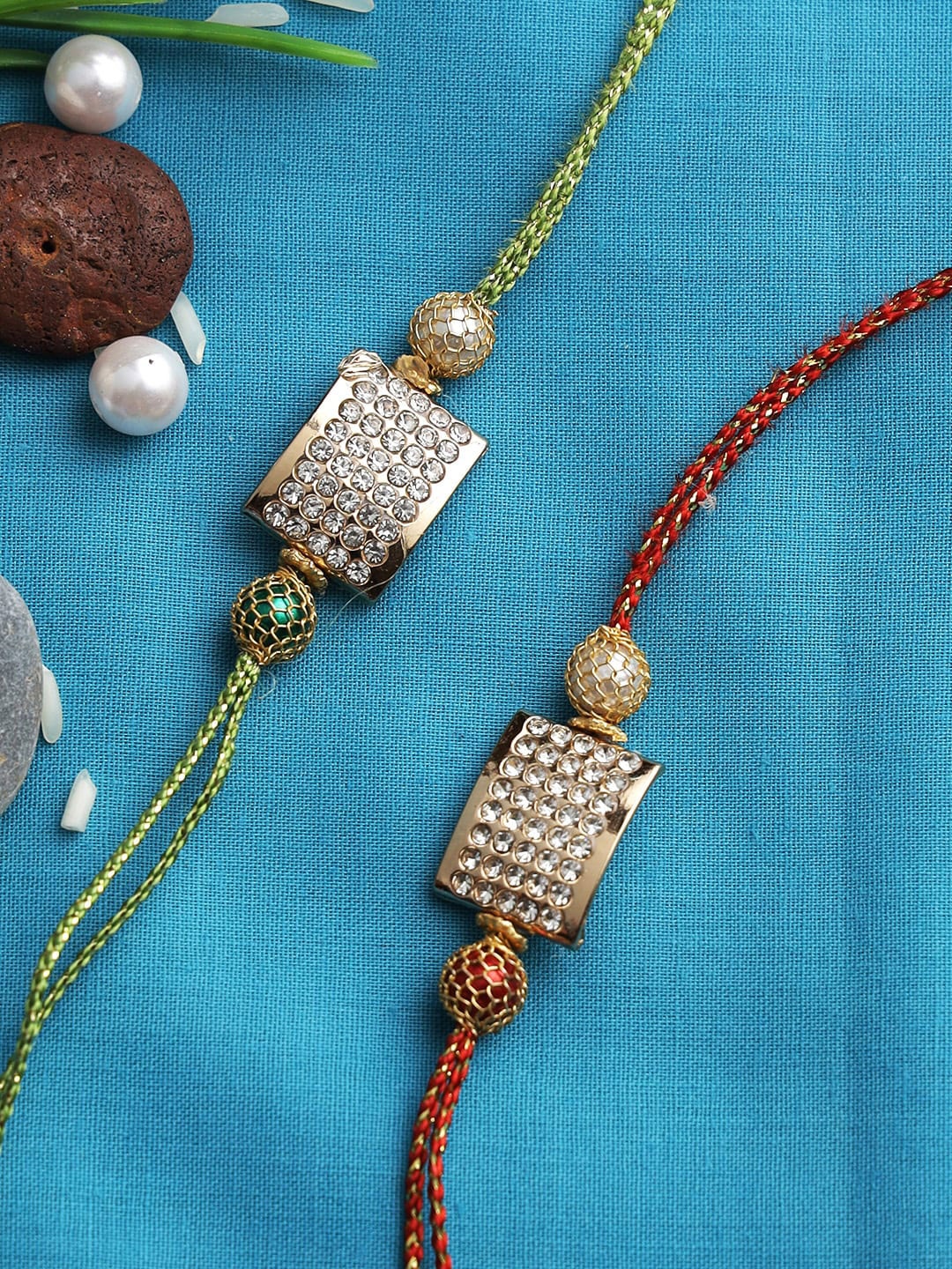 

Aapno Rajasthan Set of 2 Red & Green Stylish Metal Rakhi with Diamond