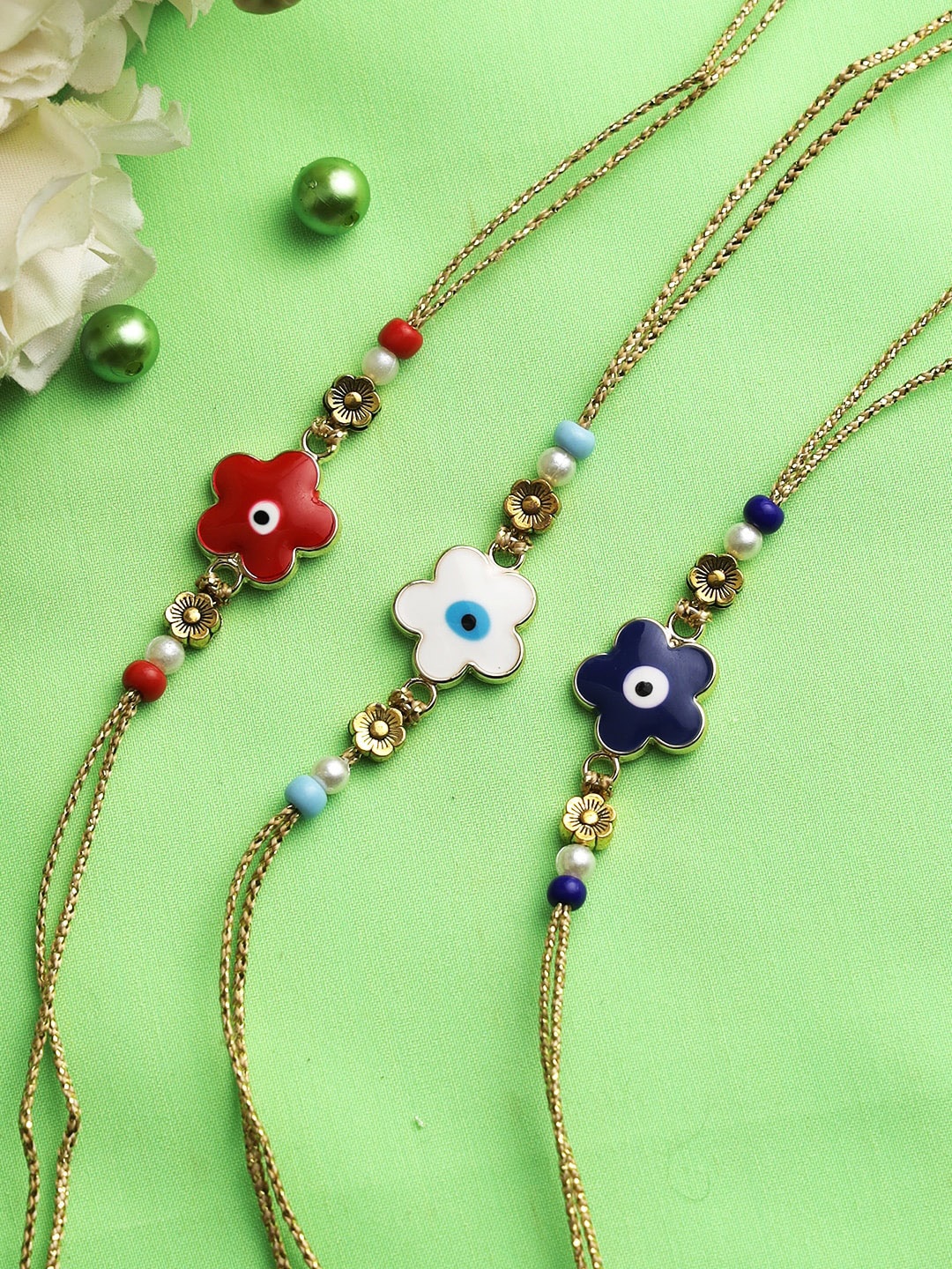 

Aapno Rajasthan Set of 3 Floral Evil Eye Thread Rakhi, Multi