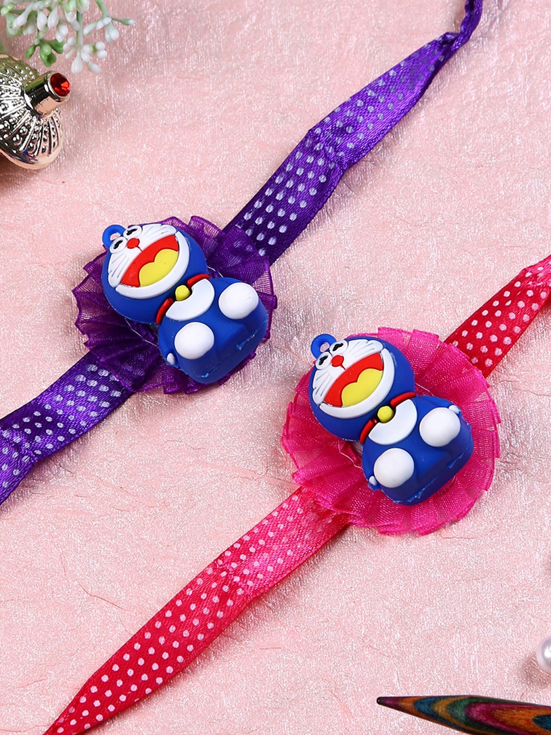 

Aapno Rajasthan Set of 2 Doraemon in Flower Rakhi, Multi