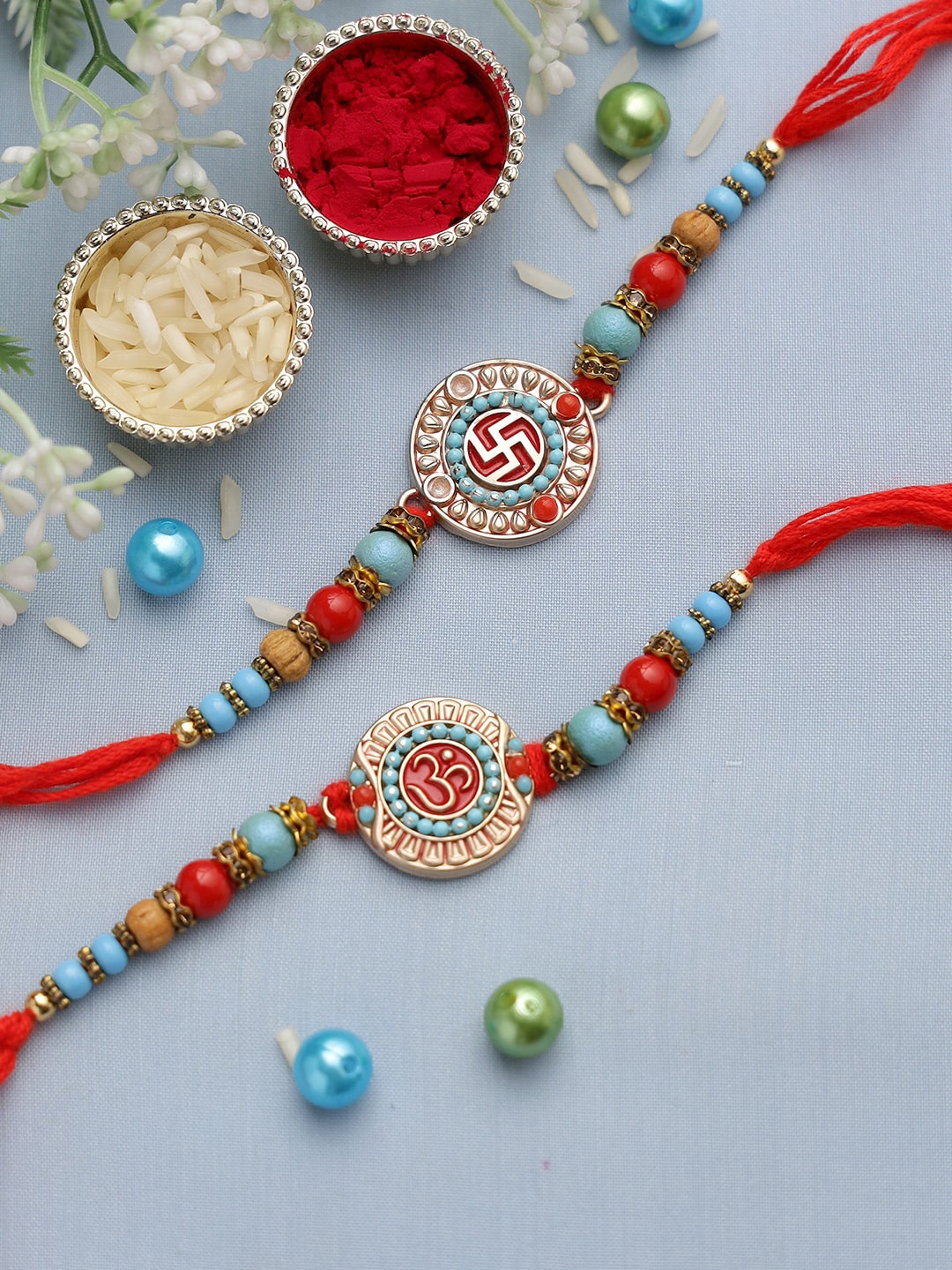

Aapno Rajasthan Set of 2 Red & Blue Beaded Om and Swastika Rakhi
