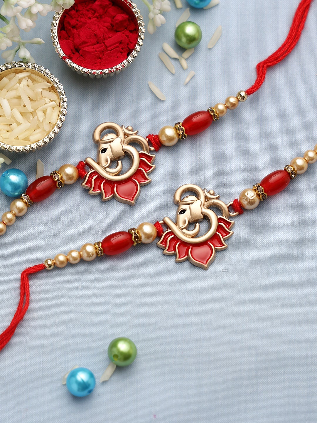 

Aapno Rajasthan Set of 2 Ganesha In Om Rakhis, Red