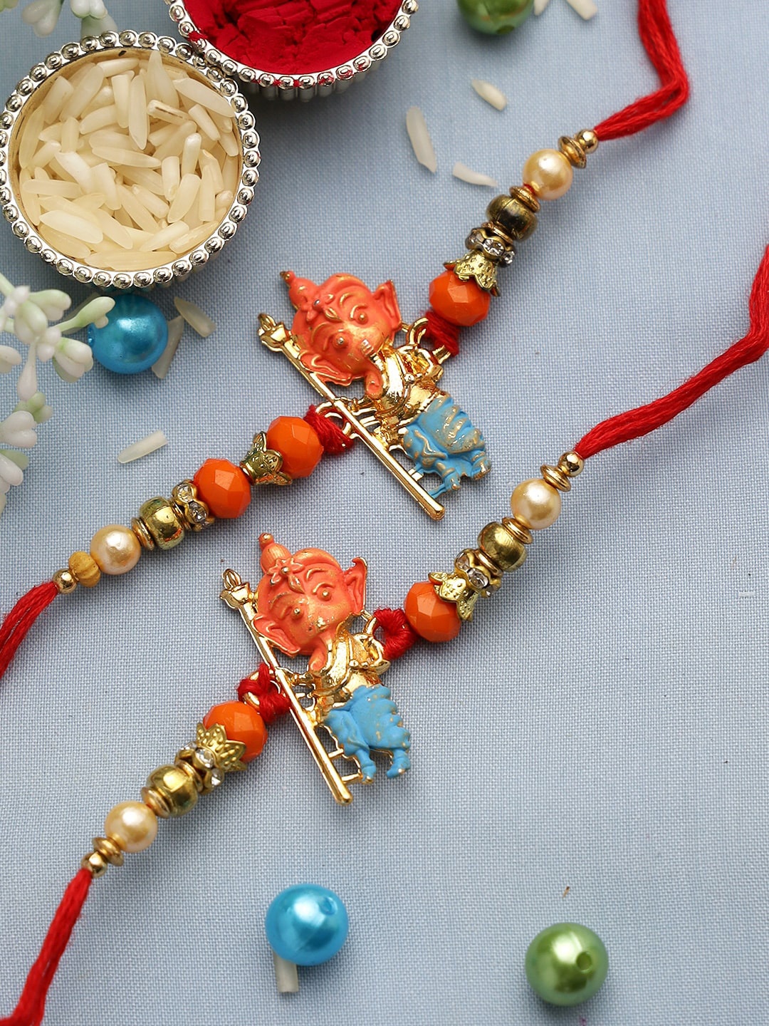 

Aapno Rajasthan Multicolored Set of 2 Ganesha Rakhi, Multi