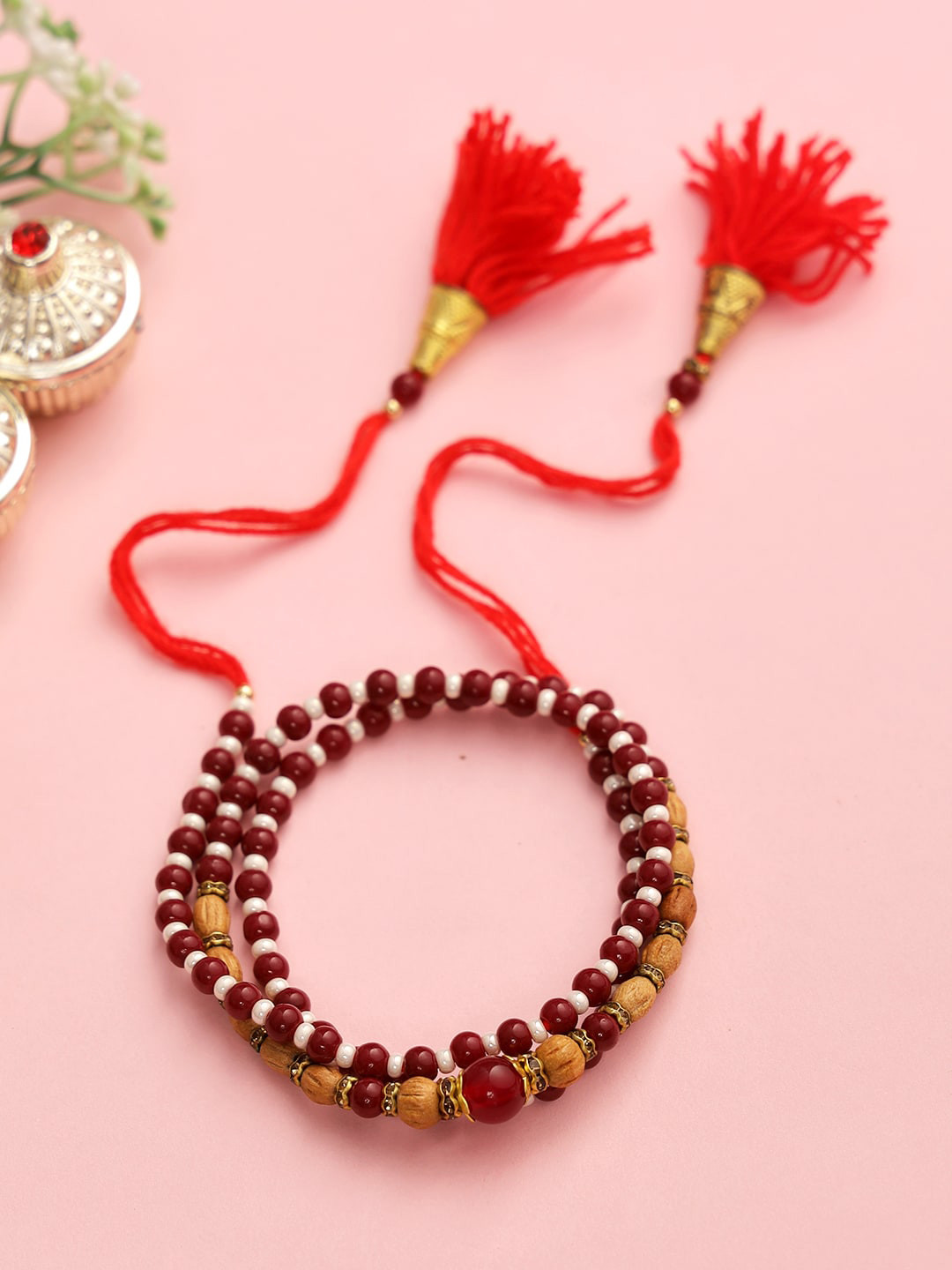 

Aapno Rajasthan Adults-Unisex Brown Bracelete Style Rudraksh Rakhi With Roli Chawal & Card