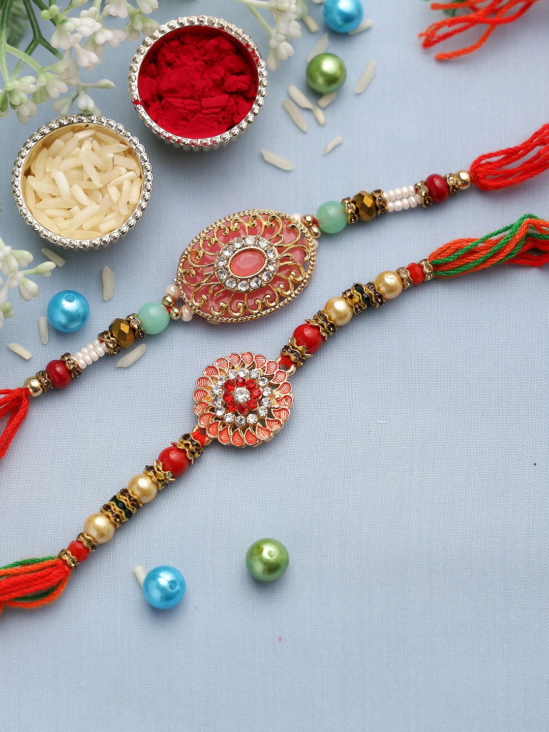 

Aapno Rajasthan Set of 2 Multicolored Beaded Metal Thread Rakhi, Red