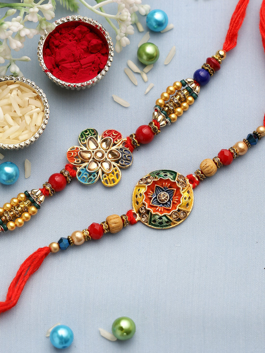 

Aapno Rajasthan Set of 2 Multicolored Rangoli Thread Rakhi, Red