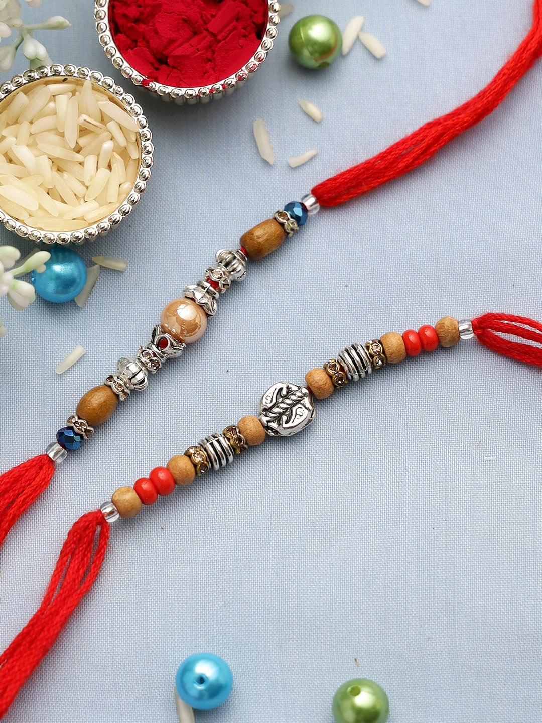 

Aapno Rajasthan Set Of 2 Red & Orange Beaded Rakhis