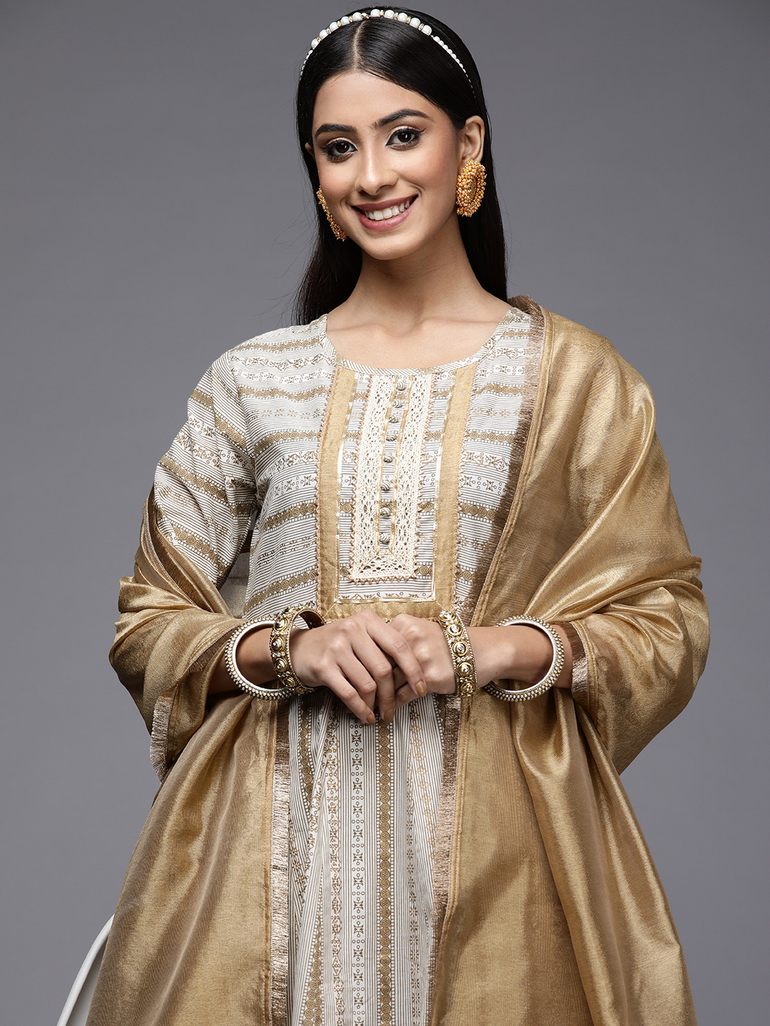 

Indo Era Women Off White & Golden Printed Yoke Design Kurta with Trousers & Dupatta