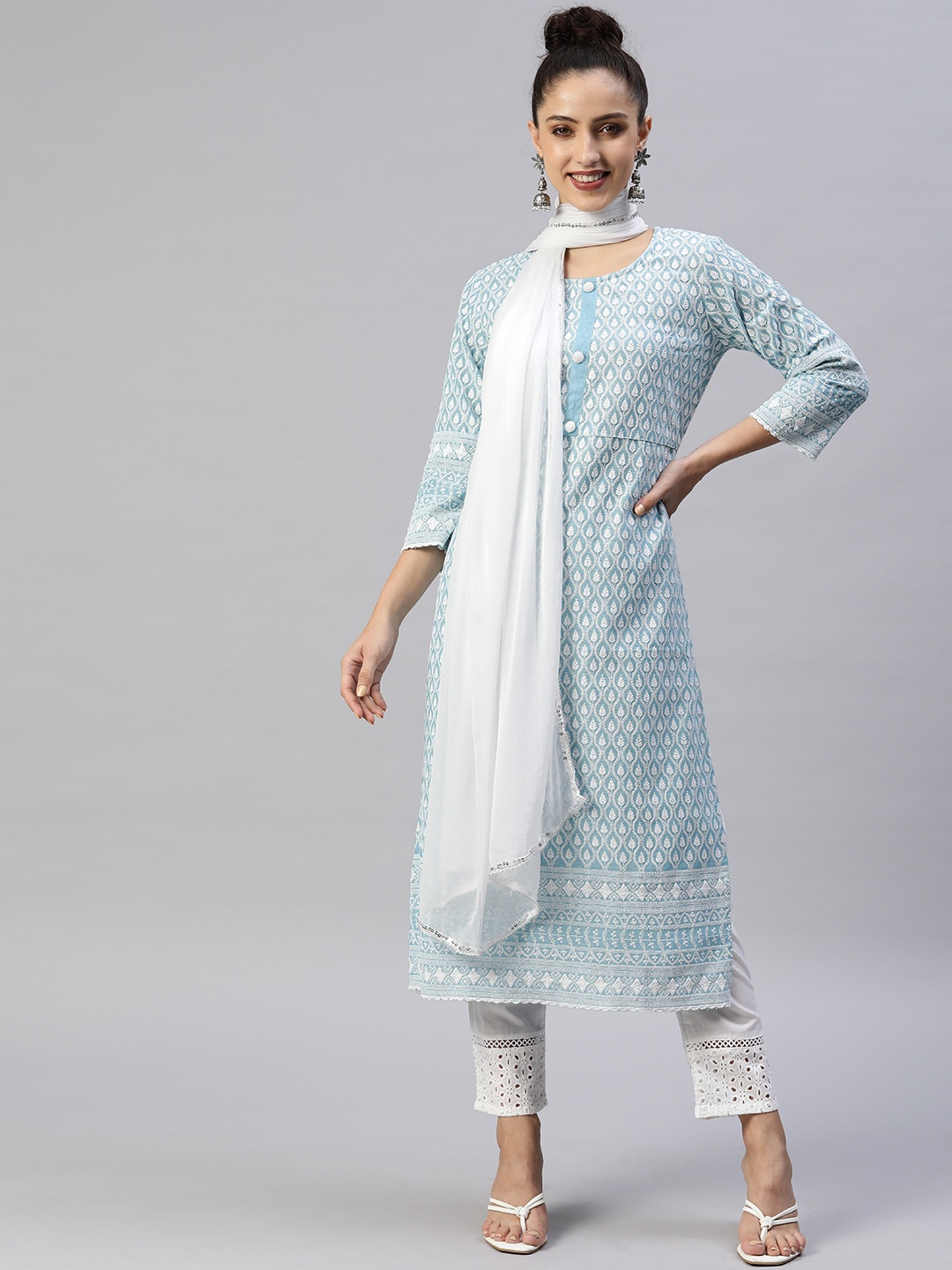 

Readiprint Fashions Women Turquoise Blue Ethnic Motifs Thread Work Cotton Kurta Set
