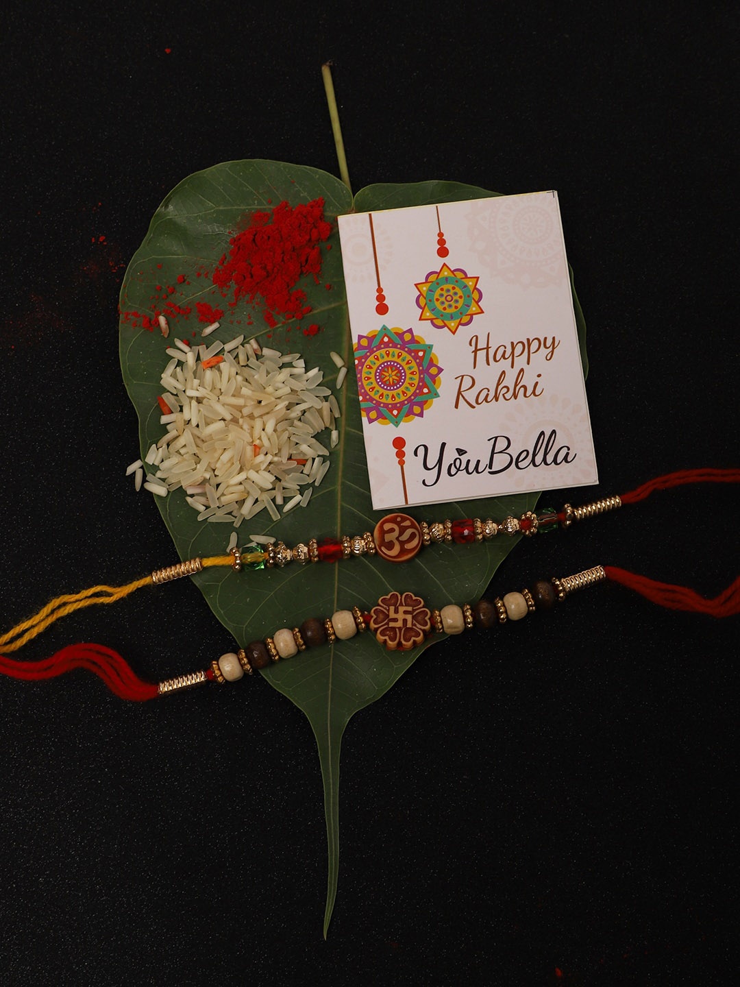 

YouBella Men Set Of 2 Multi-Colored Om & Swastik Tie-Up Rakhi With Greeting Card, Roli & Chawal