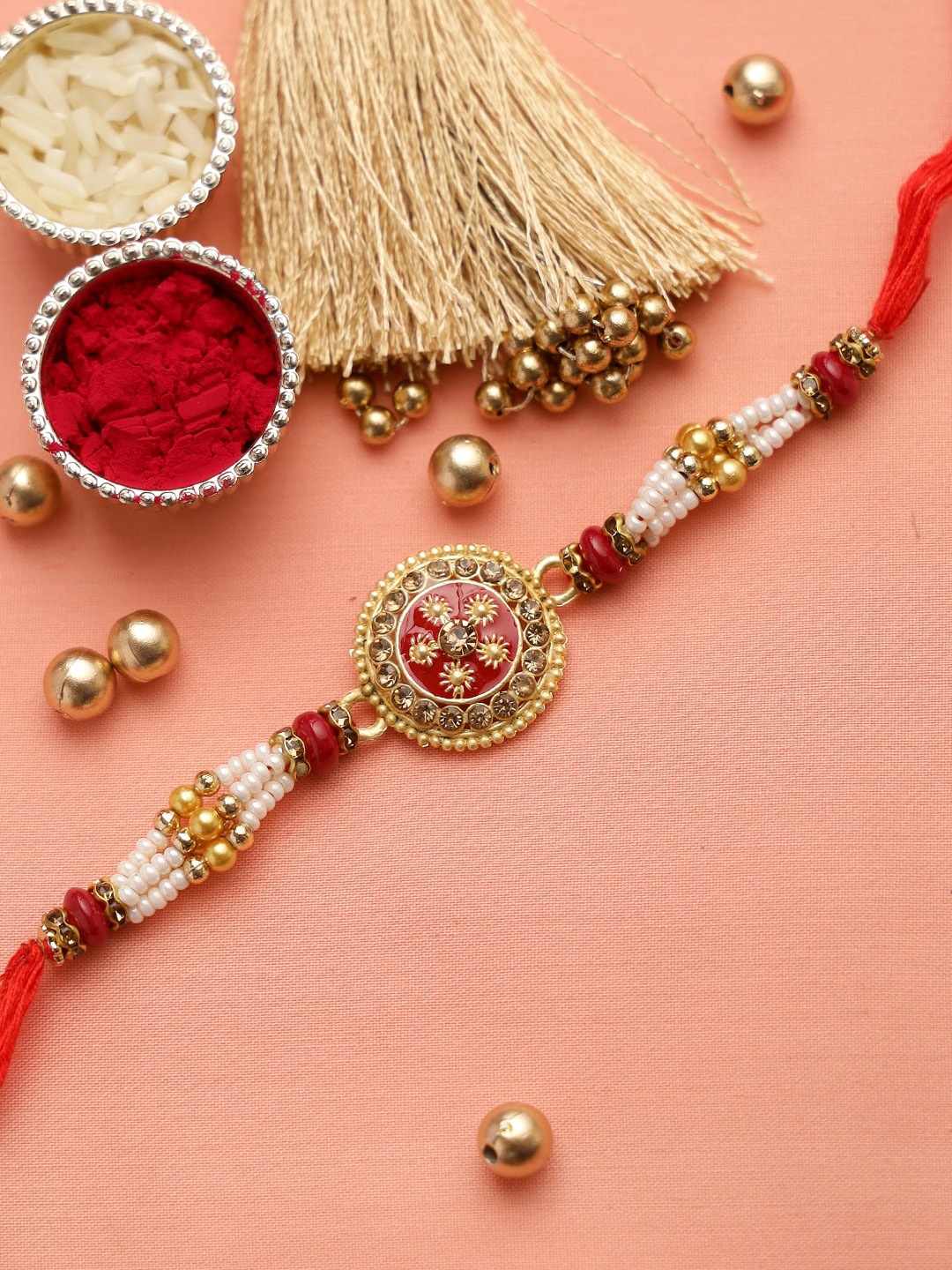 

Aapno Rajasthan Gold-Toned & Red Circular Meenawork Beaded Rakhi