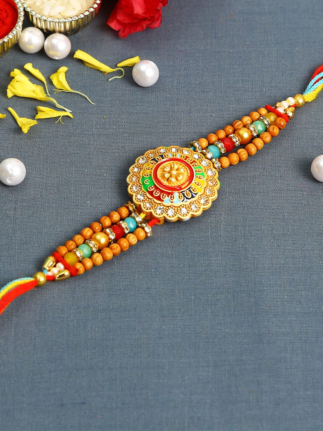 

Aapno Rajasthan Multicoloured Ghoomar Design Meena Work Rakhi with Roli Chawal & Card, Multi
