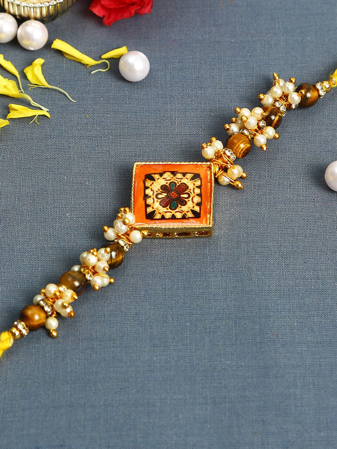 

Aapno Rajasthan Golden & White Pearl Beaded Floral Rakhi With Roli Chawal &Greeting Card, Gold