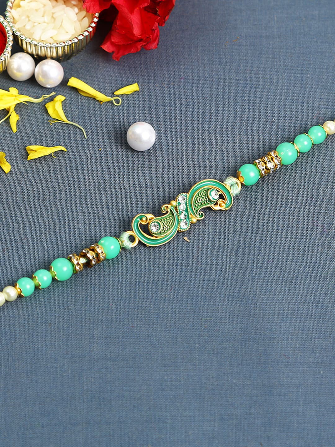 

Aapno Rajasthan Sea Green Beaded Peacock Thread Rakhi