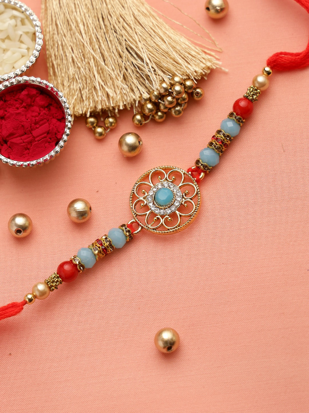 

Aapno Rajasthan Red & Turquoise Blue AD Studded Rakhi with Roli Chawal & Card