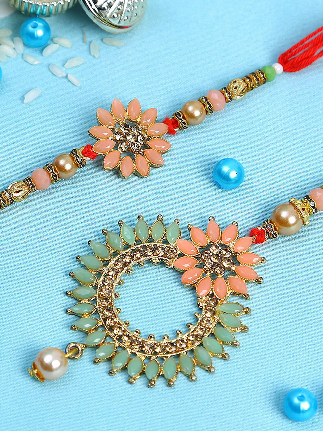

Aapno Rajasthan Set Of 2 Multicolour Kundan Bhaiya Bhabhi Rakhi Set with Pearl Dangler, Peach