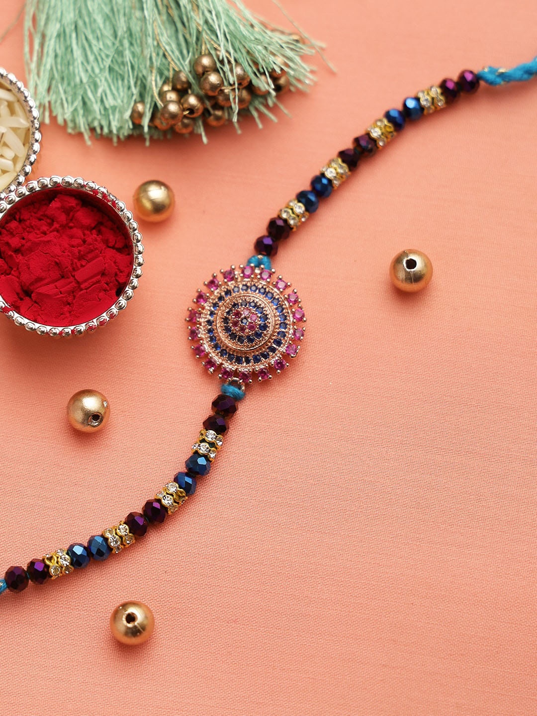 

Aapno Rajasthan Multicoloured Beaded Circular Thread Rakhi, Multi