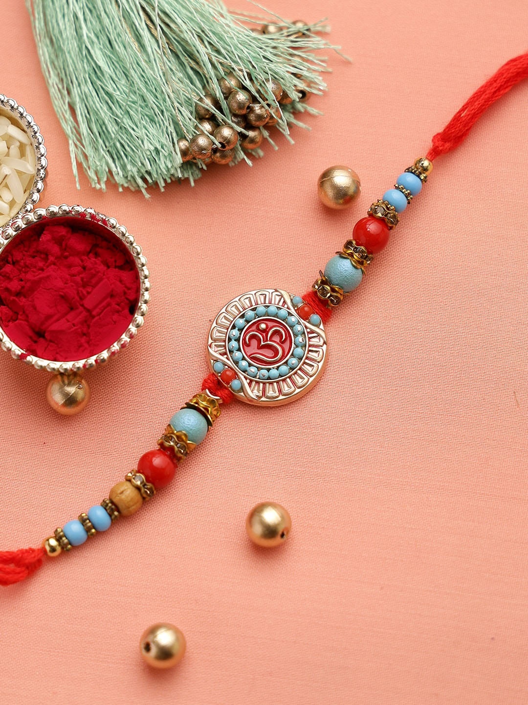 

Aapno Rajasthan Red & Turquoise Blue Beaded OM Rakhi