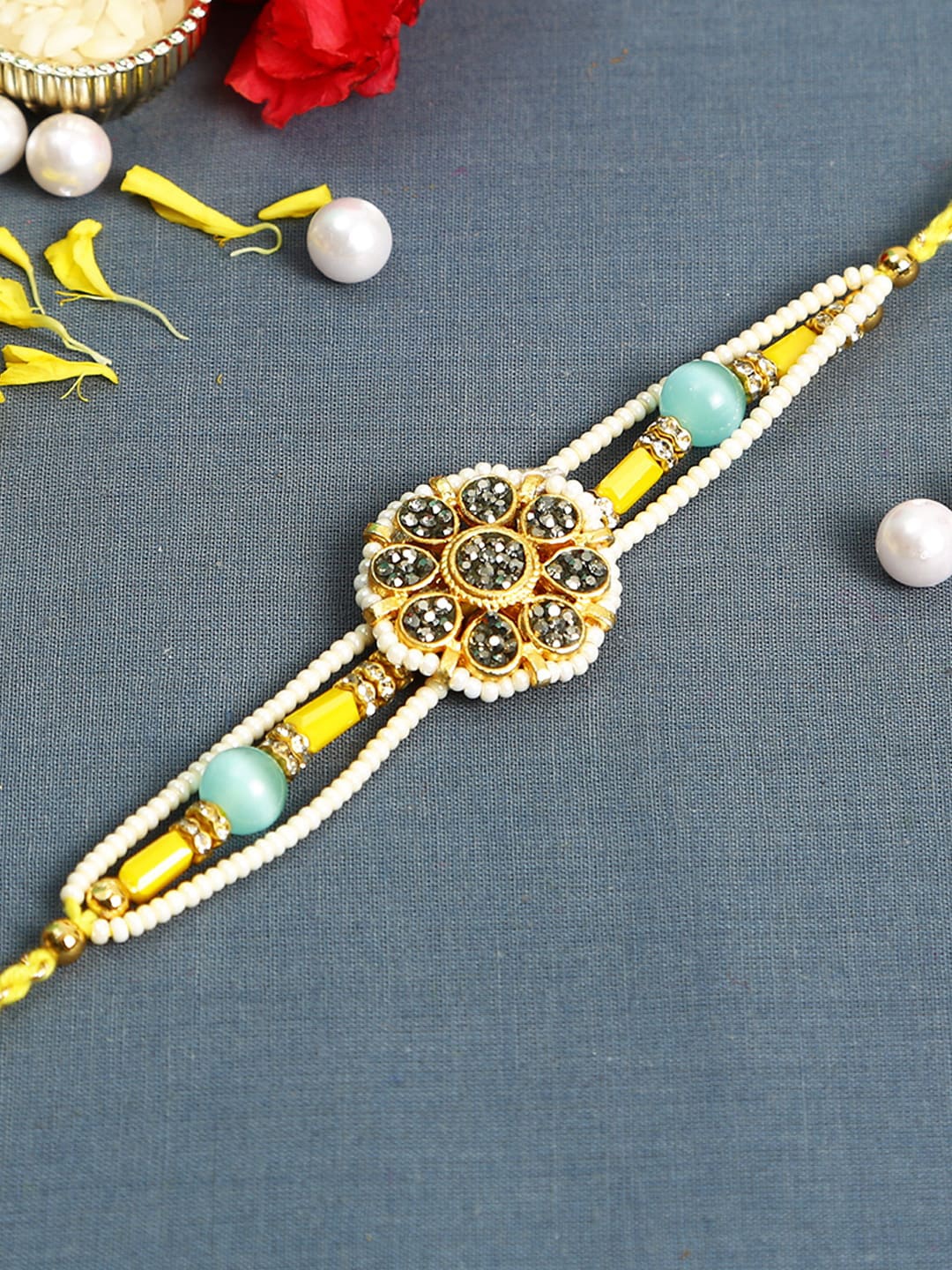 

Aapno Rajasthan Yellow & White Floral Rakhi with Pearl Beads & American Diamonds