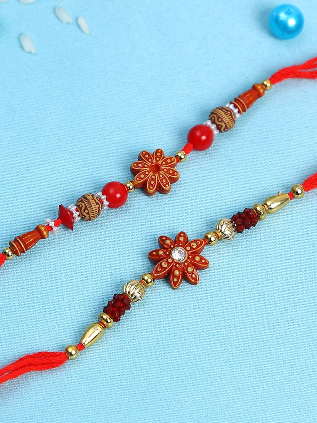 

Aapno Rajasthan Set Of 2 Wooden Flower Rakhi, Red