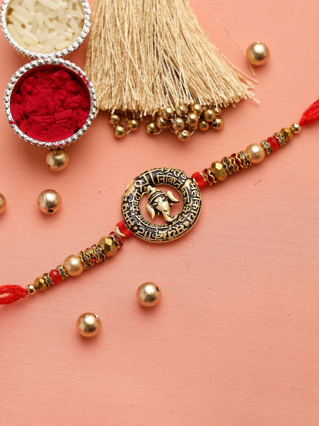 

Aapno Rajasthan Red Rustic Finish Ganapati Manta Divine Thread Rakhi