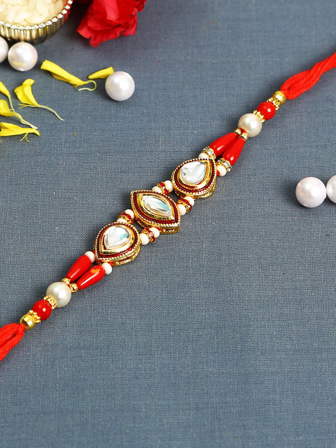 

Aapno Rajasthan Red Kundan Studded Rakhi