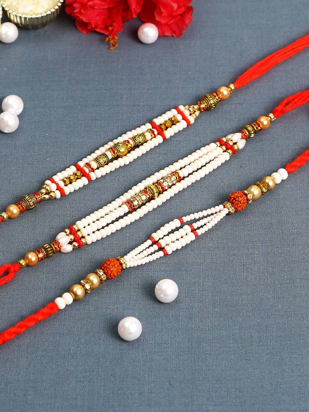 

Aapno Rajasthan White & Golden Pearl and Beads Rakhis