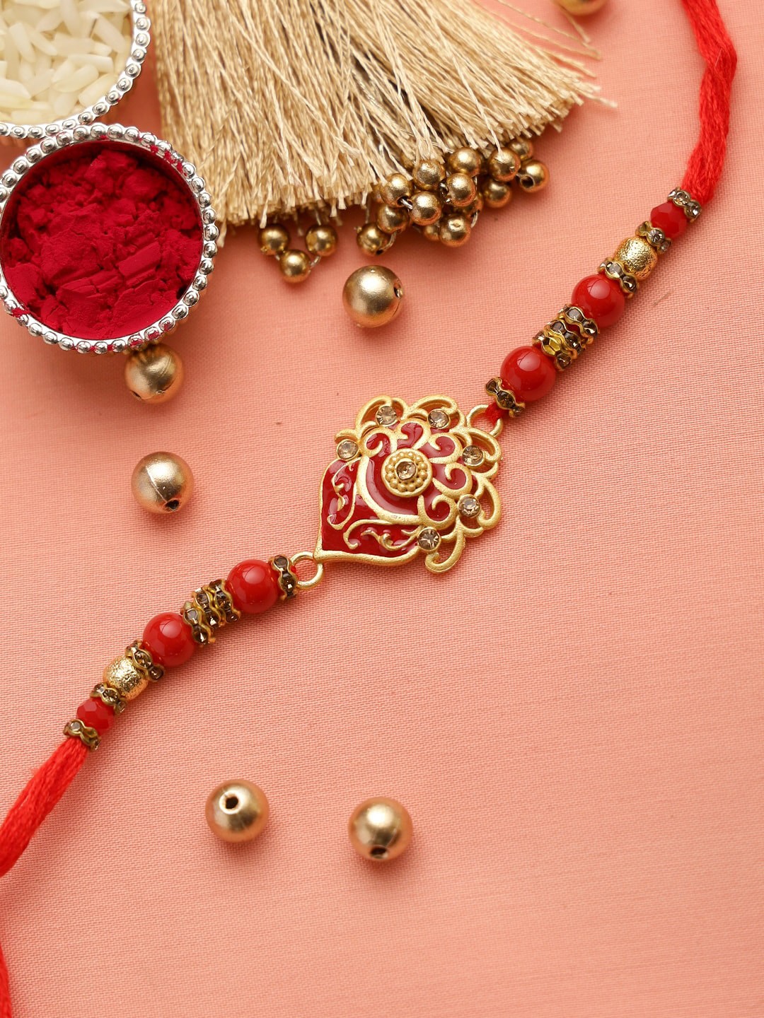 

Aapno Rajasthan Red & Gold-Toned Beaded Stone Stud Rakhi