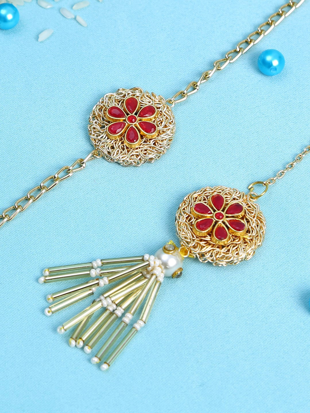 

Aapno Rajasthan Gold-Toned & Red Floral Bhaiya Bhabhi Rakhi Combo