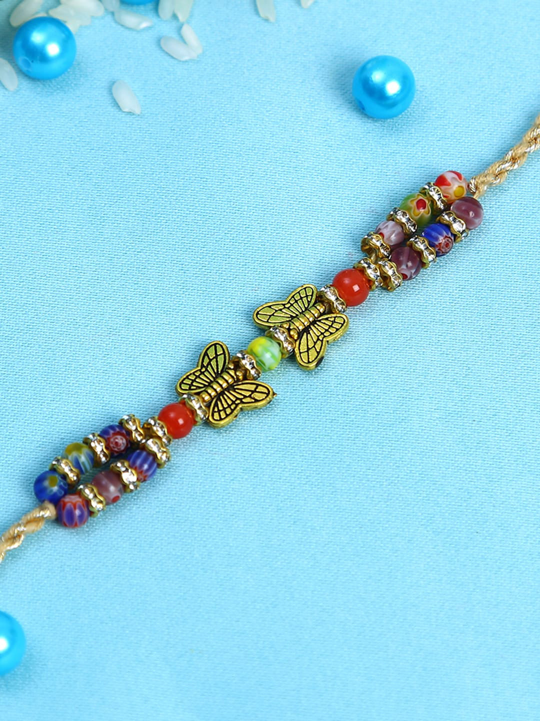 

Aapno Rajasthan Multicoloured Butterfly Beaded Rakhi with Roli Chawal & Card, Multi