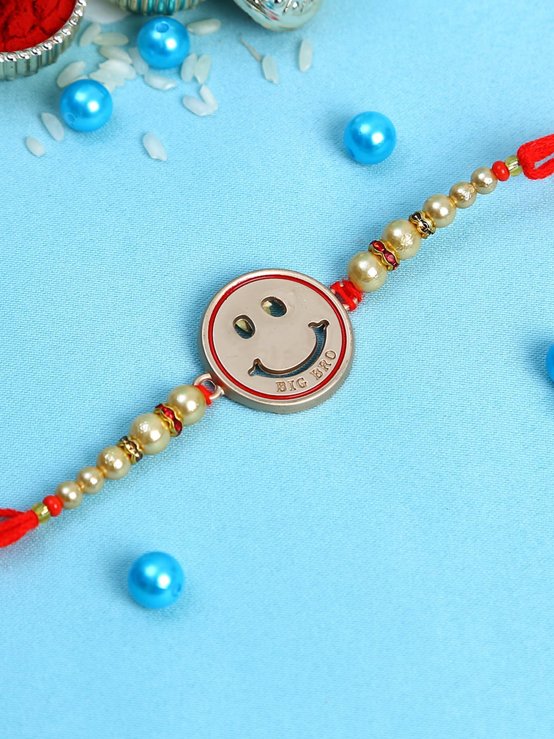 

Aapno Rajasthan Kids Red Cute Smily Rakhi with White Pearls