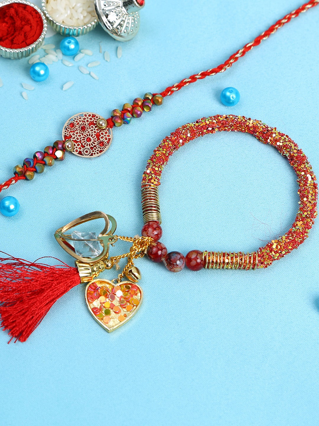 

Aapno Rajasthan Set Of 2 Red Metal Filigree Work Bhaiya Bhabhi Rakhi Set