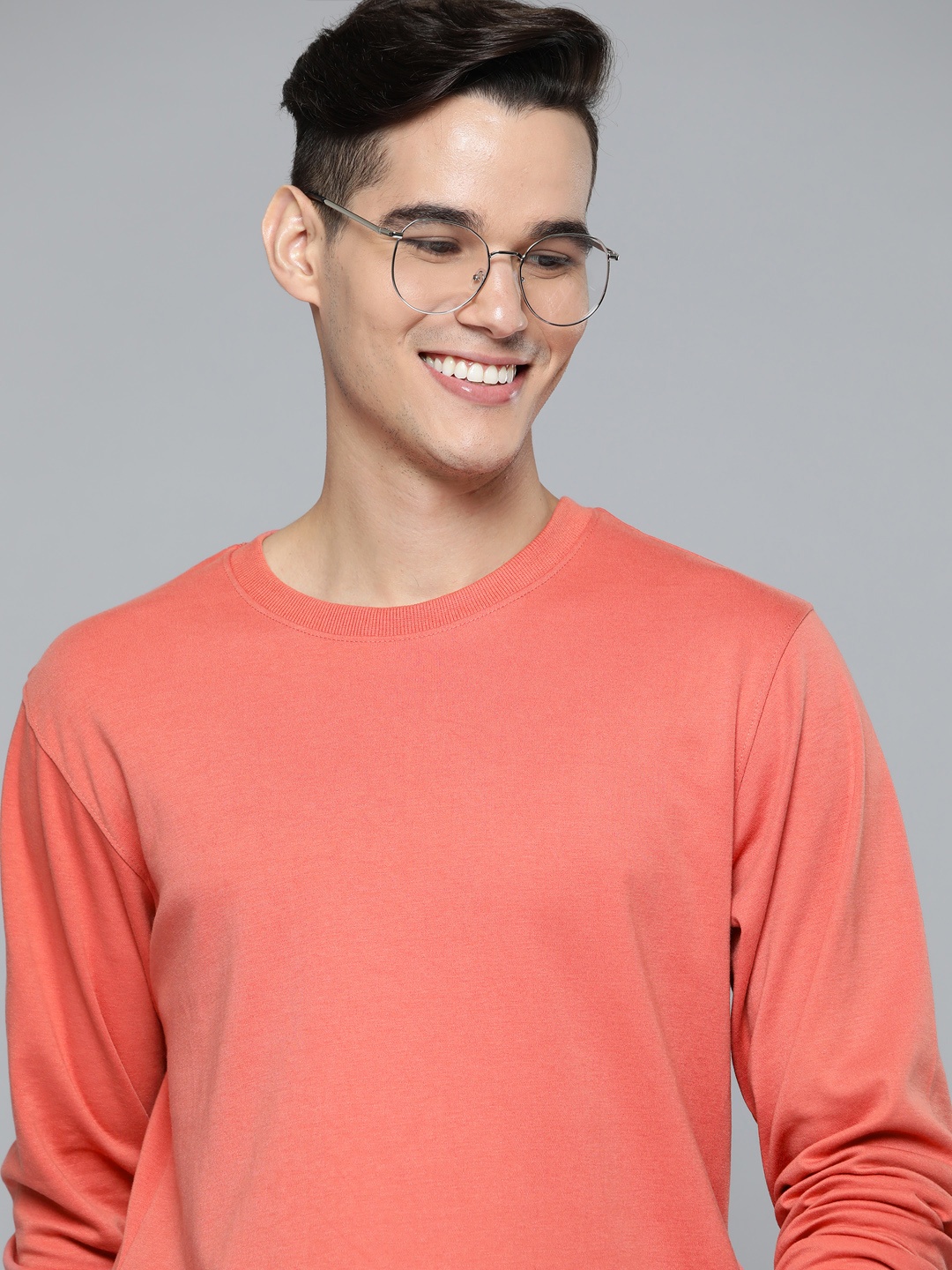 

Mast & Harbour Men Coral Orange Solid Sweatshirt