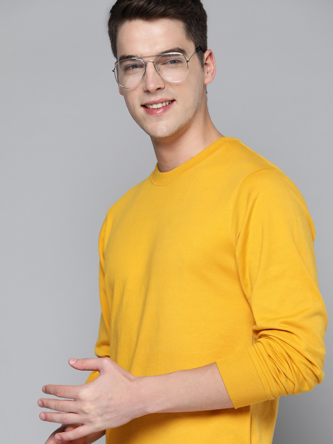 

Mast & Harbour Men Mustard Yellow Solid Sweatshirt