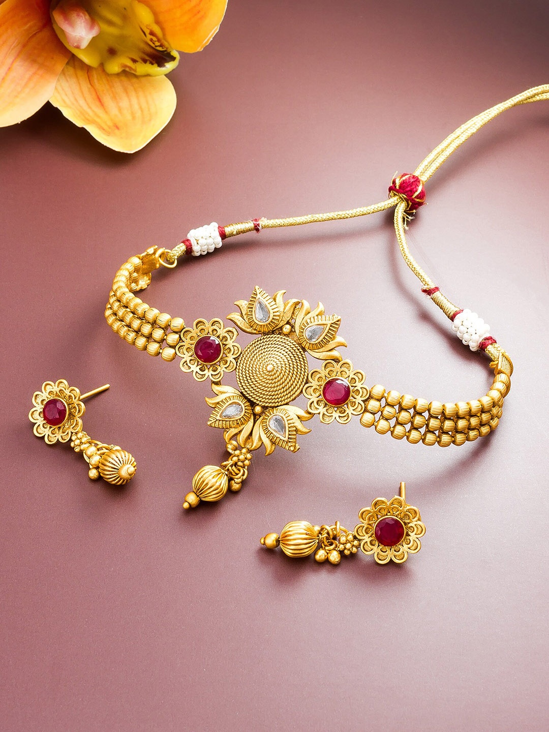 

aadita Gold Plated & Red Stone Studded Jewellery Set