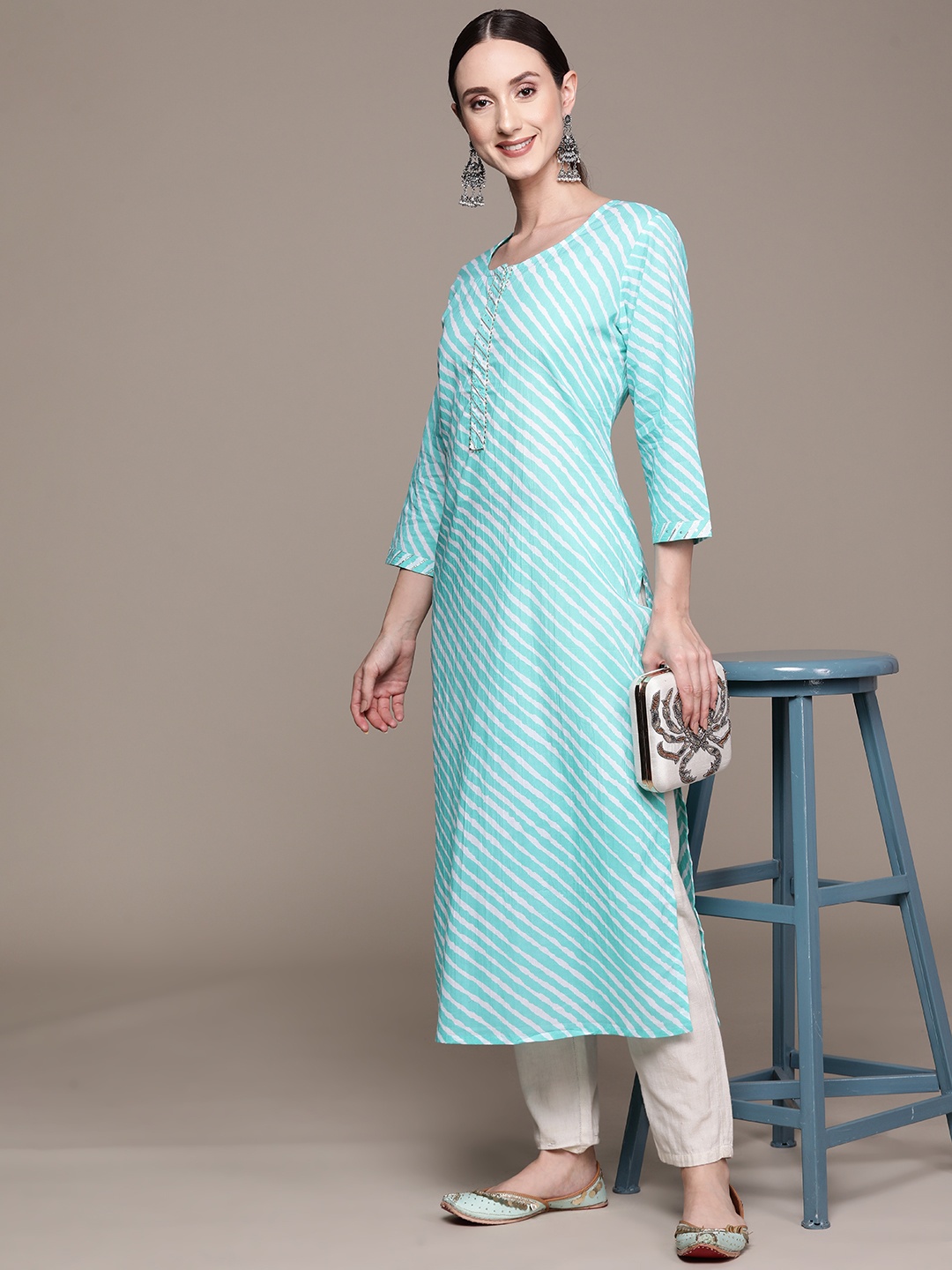

Ishin Women Sea Green & White Leheriya Printed Gotta Patti Pastels Kurta