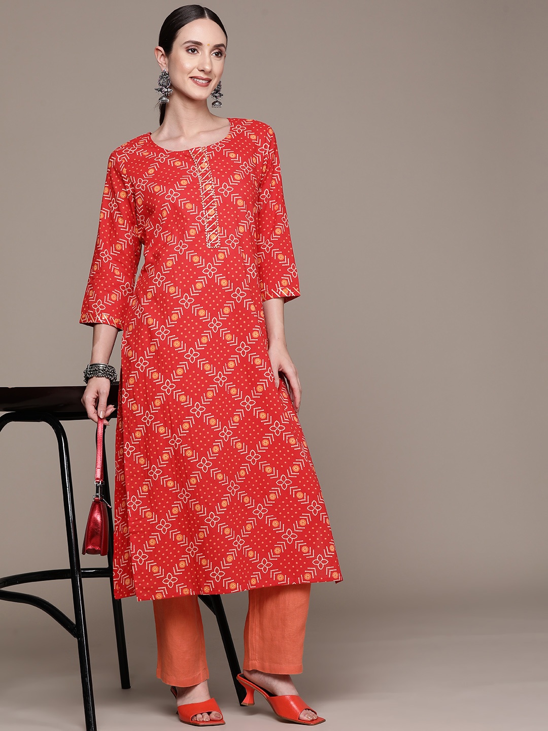 

Ishin Women Red Bandhani Printed Gotta Patti Kurta