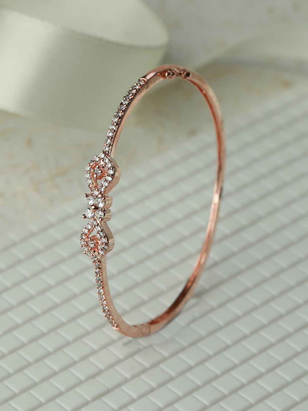

Priyaasi Women Rose Gold-Plated Brass American Diamond Studded Bangle-Style Bracelet