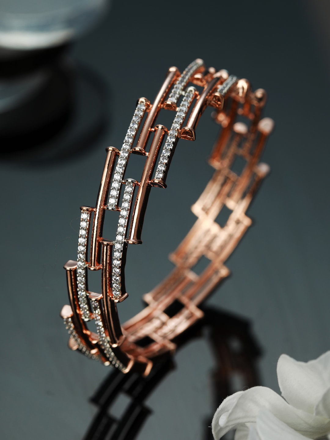 

Priyaasi Women Rose Gold & Silver-Toned Brass American Diamond Rose Gold-Plated Bangle-Style Bracelet