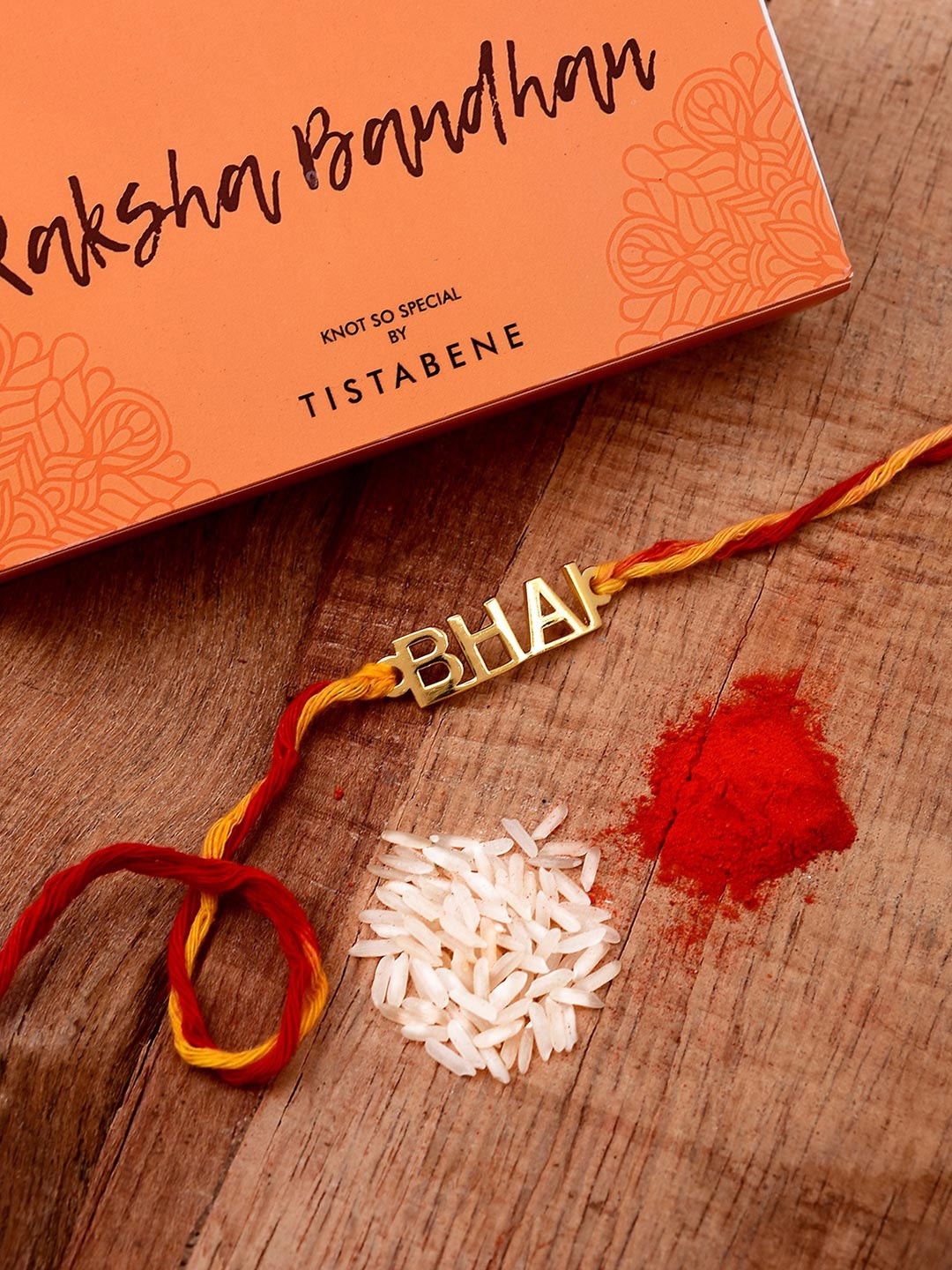 

Tistabene Men Gold-Toned & Red Bhai Design Name Rakhi