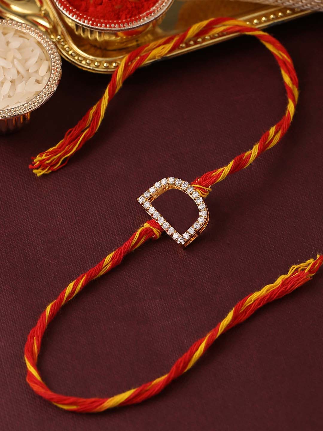 

Tistabene Men Red & Yellow Stone Sudded D-Alphabet Rakhi With Roli Chawal