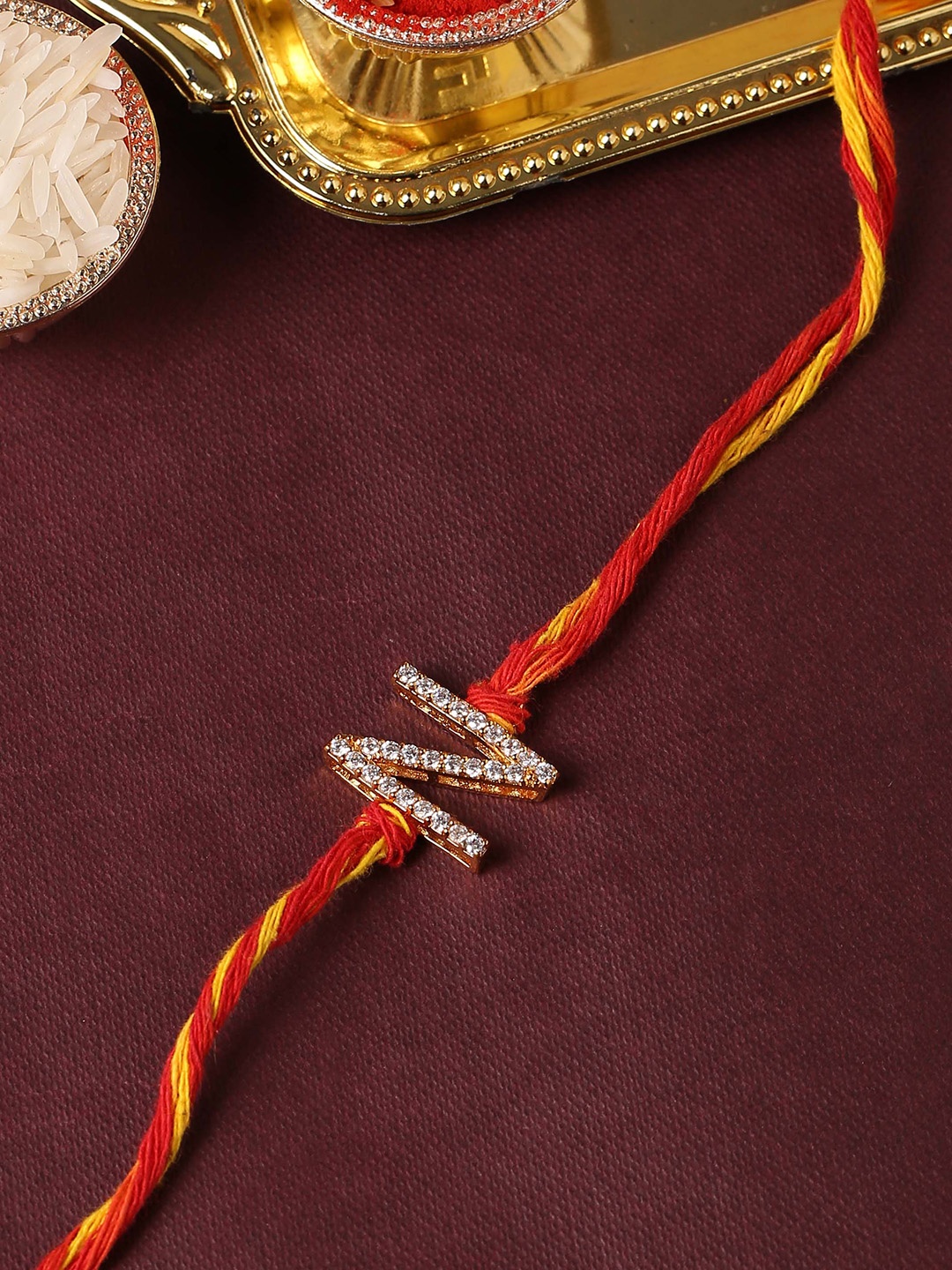 

Tistabene Men Red & Gold AD Stone Studded Thread Rakhi