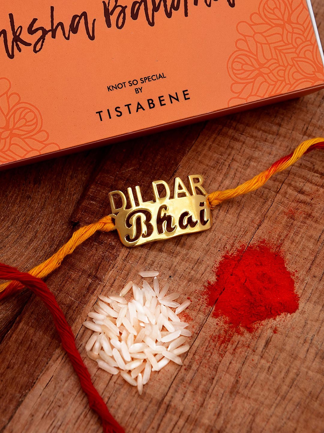 

Tistabene Men Gold-Toned & Red Bhai Design Name Rakhi