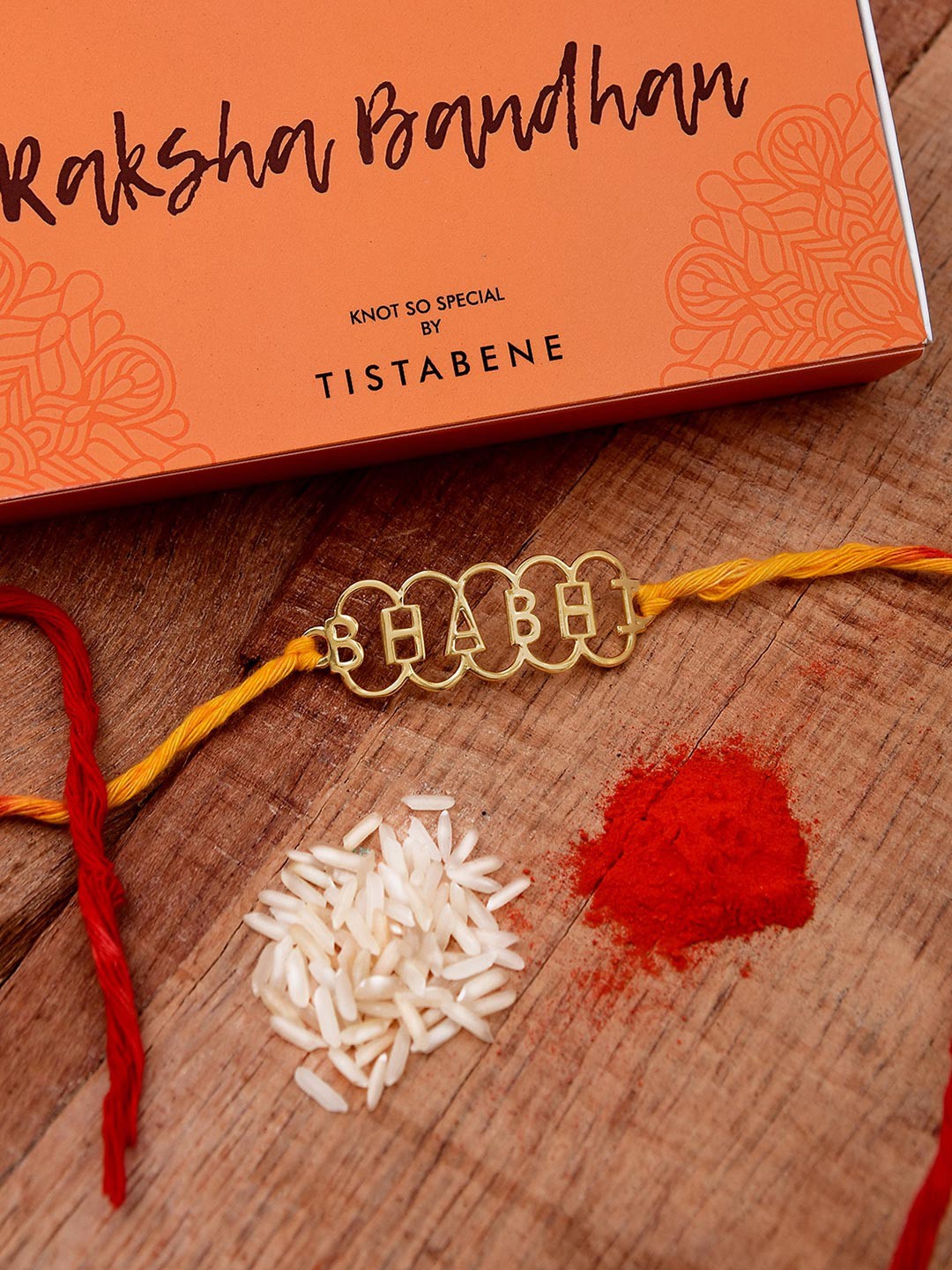

Tistabene Gold-Toned Bhabhi Design Name Rakhi