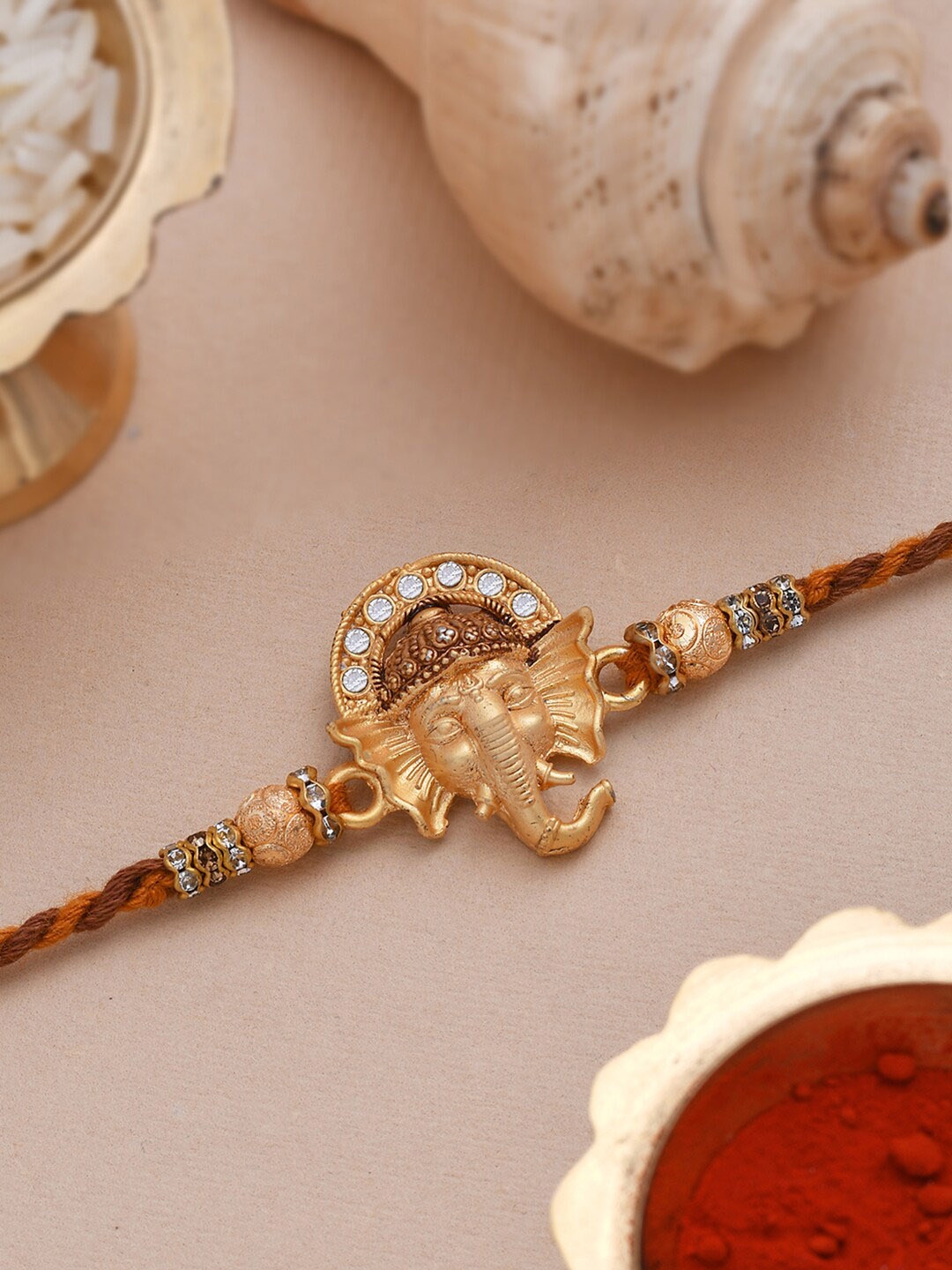 

Dare by Voylla CZ Embellished Deity Inspired Ganpati Rakhi, White