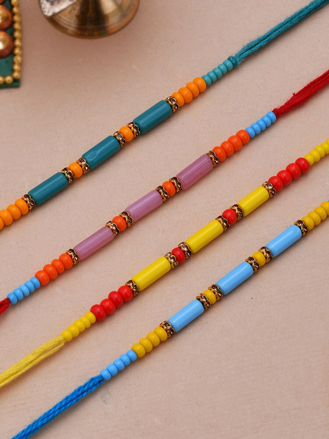 

Dare by Voylla Set of 4 Colorful Beads embedded Rakhi, Yellow