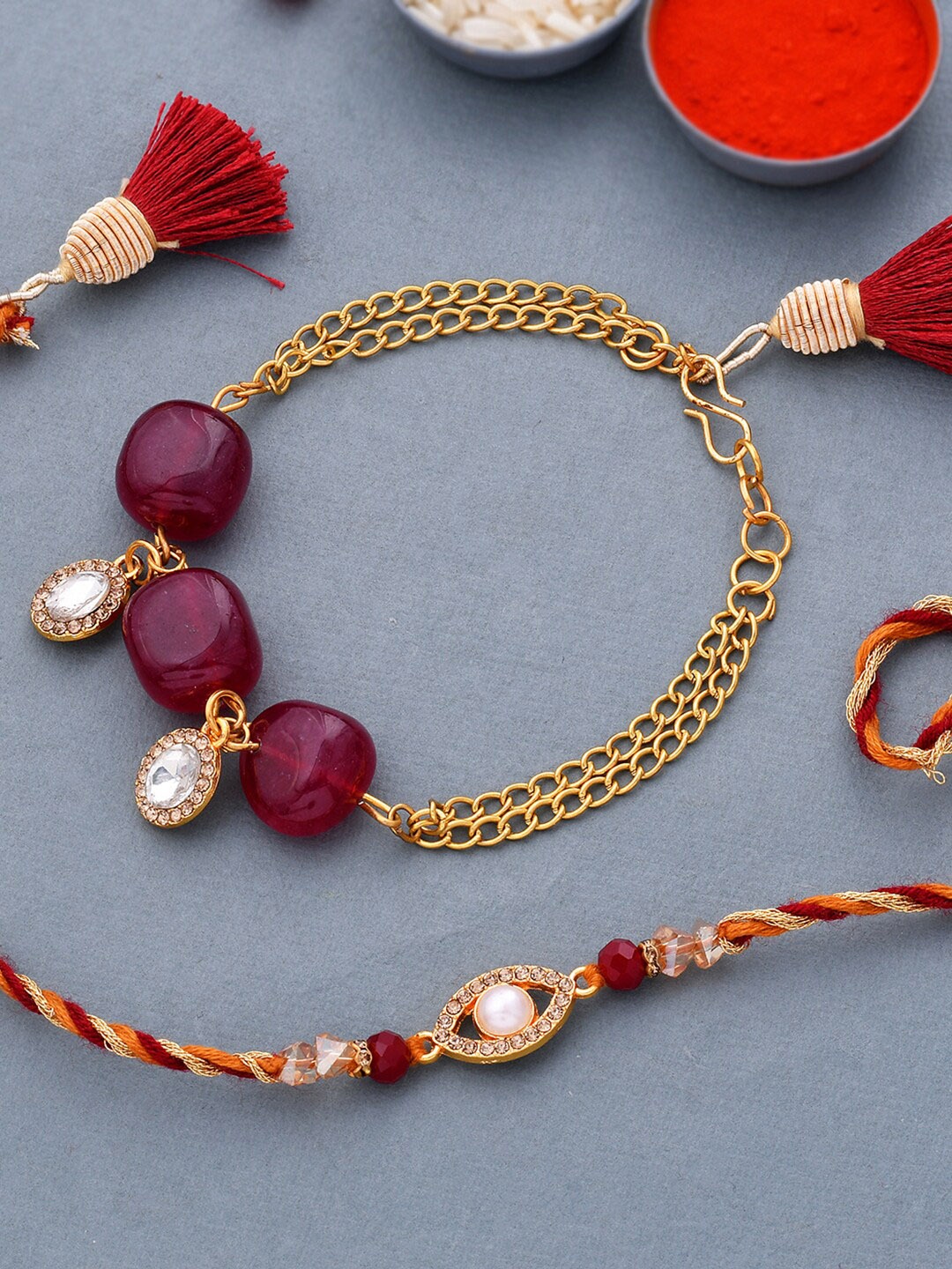 

Voylla Pack Of 2 Maroon CZ Embellished Traditional Bracelet Style Lumba Rakhi