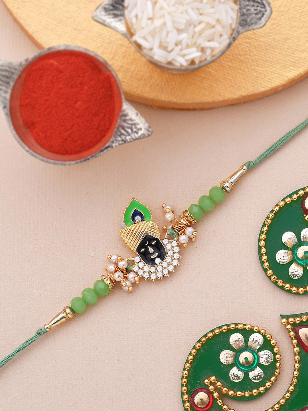 

Dare by Voylla Men Gold-Toned & White Stone Studded & Beaded Lord Krishna Rakhi