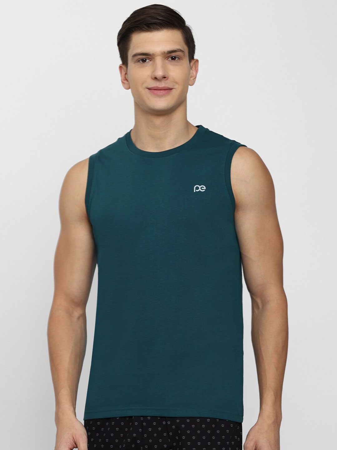 

Peter England Men Green Solid Sleeveless T-shirt