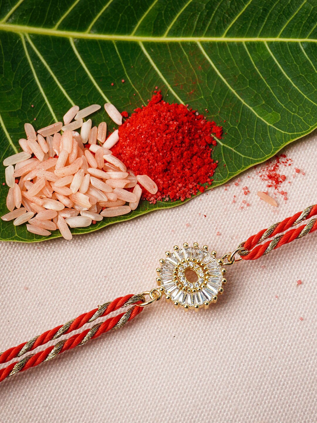 

Ferosh Gold & Red Alphabet O Rhinestone Rakhi With Roli Chawal
