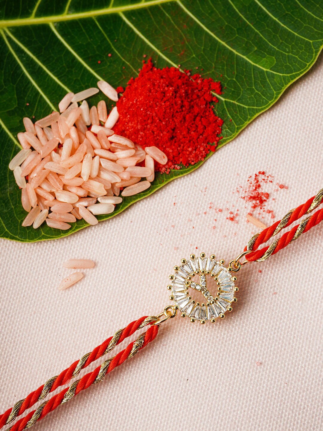 

Ferosh Gold-Toned Y Alphabet Rhinestone Rakhi